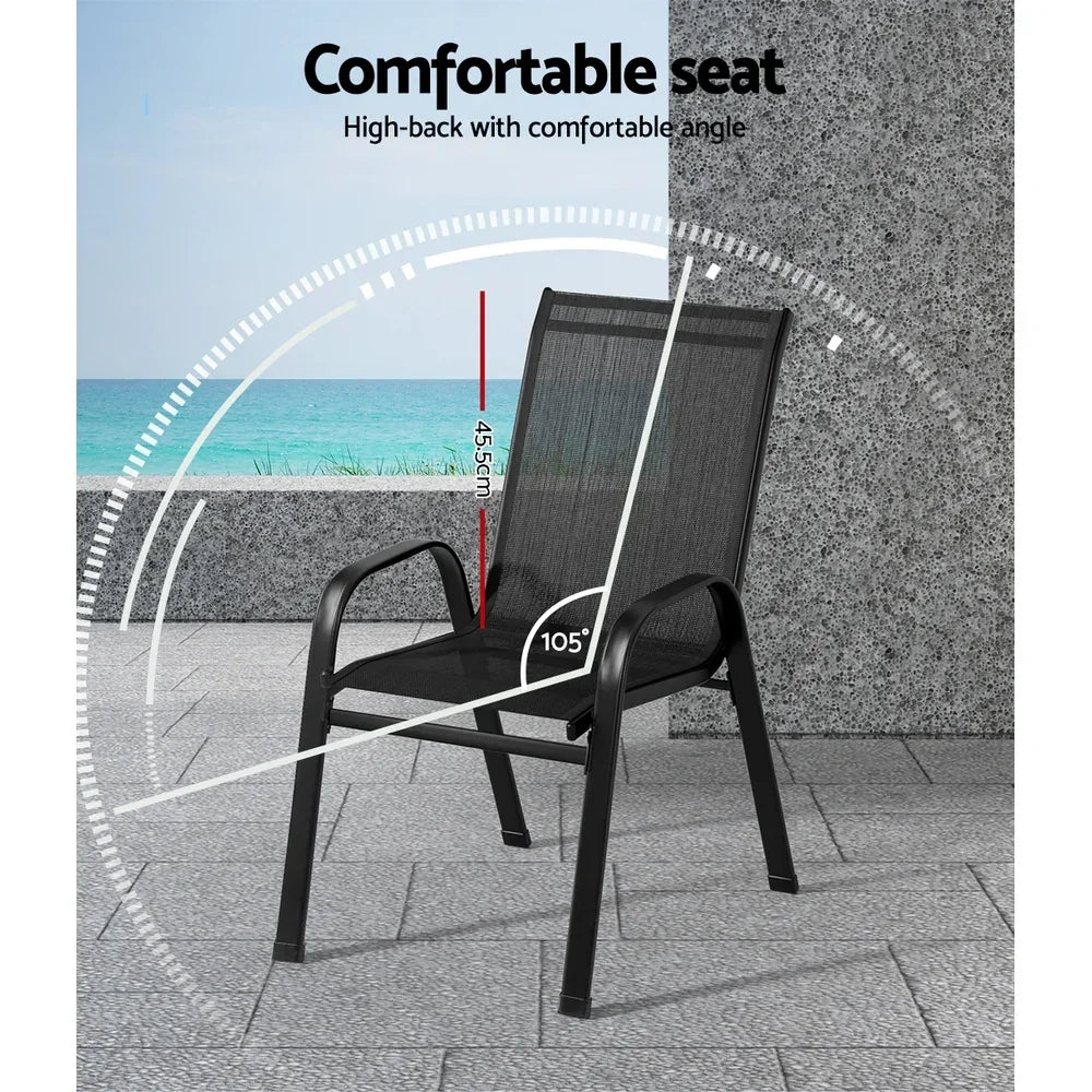 Black outdoor patio chair with high backrest, mesh seat, and armrests on a tiled terrace.