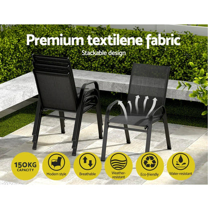 Black stackable outdoor chairs with breathable textilene fabric, modern style, on patio.