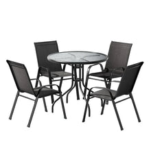 Outdoor dining set with round glass table and four black metal chairs