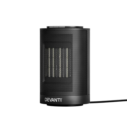Black ceramic electric heater with front mesh grille and power cord, compact tabletop design