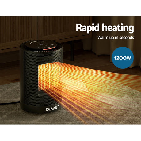 Black portable 1200W electric heater with rapid heating, warming a room on a carpeted floor.
