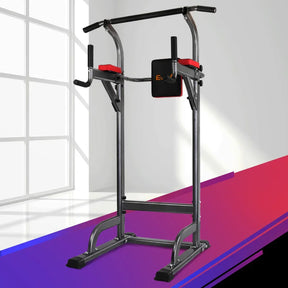 Power tower chin-up and dip station in a modern indoor setting, black and red accents