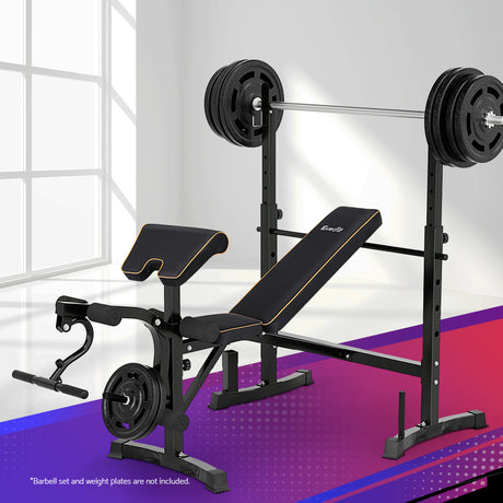 Adjustable black weight bench with preacher curl, leg developer, and barbell rack in home gym