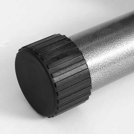 Close-up of a textured metal fitness bench leg with black plastic end cap