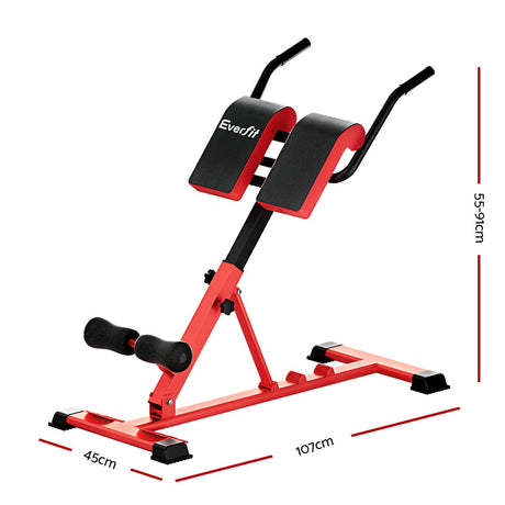 Red adjustable hyperextension bench with padded supports and measurement dimensions shown