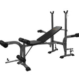 Adjustable weight bench with leg developer and barbell rack for home gym workouts