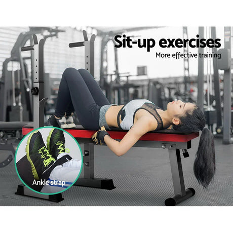 Woman performing sit-up exercises on adjustable workout bench with ankle strap in gym