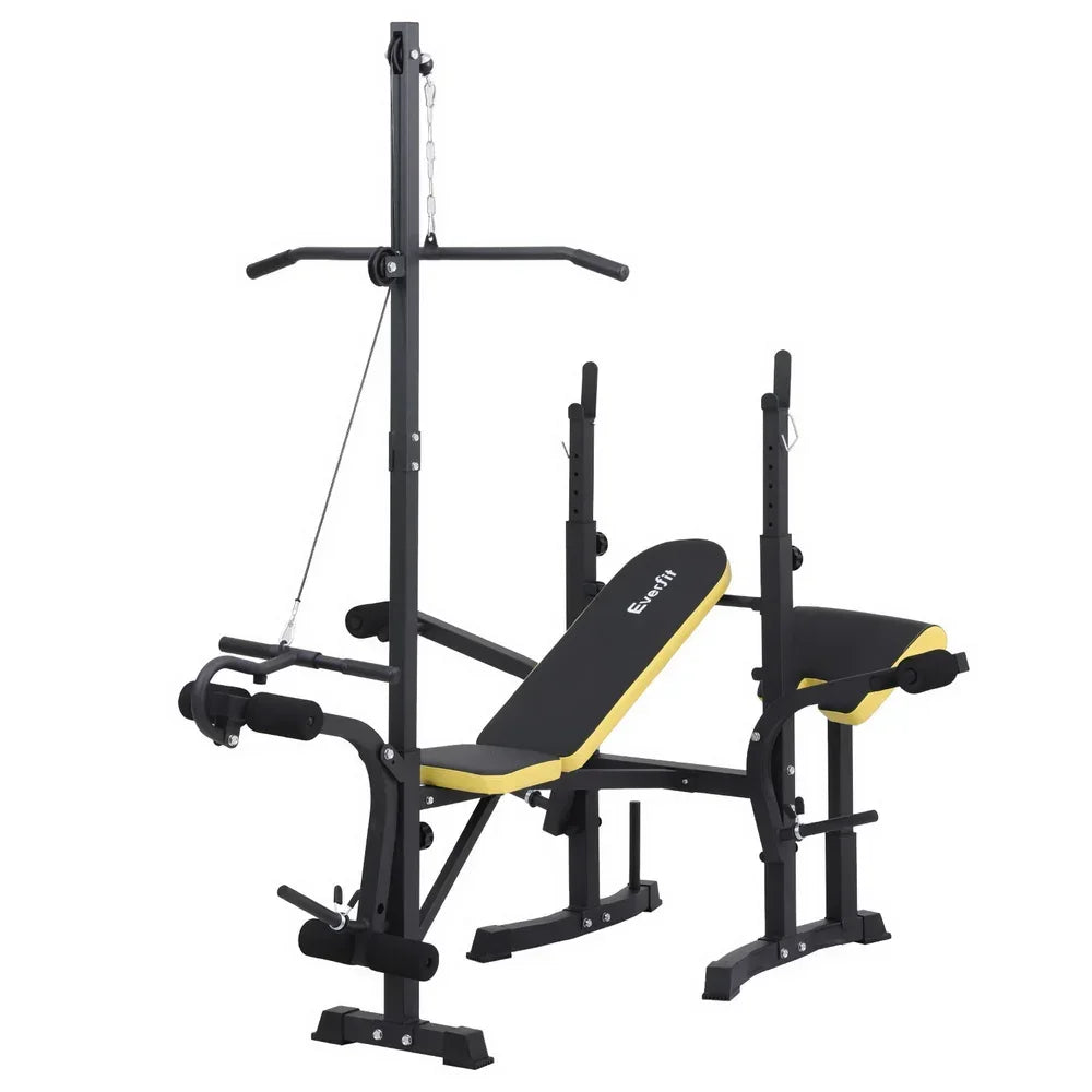 Adjustable weight bench with black and yellow padding, barbell rack, and cable pulley