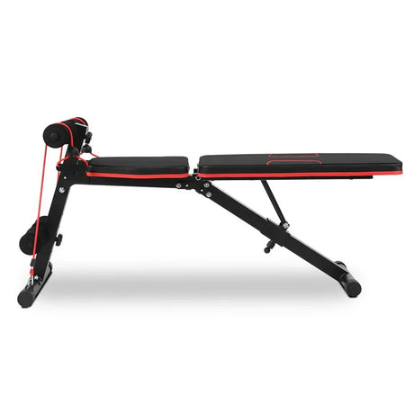 Adjustable workout bench with black padded seat, red accents, and resistance bands