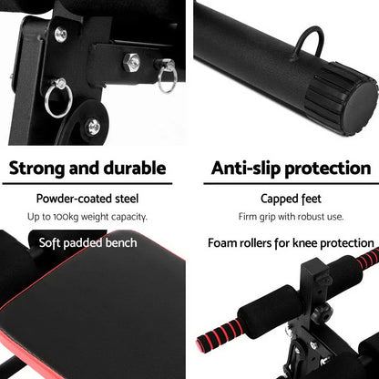 Black sit up bench with padded seat, foam rollers, powder-coated steel, and capped feet.