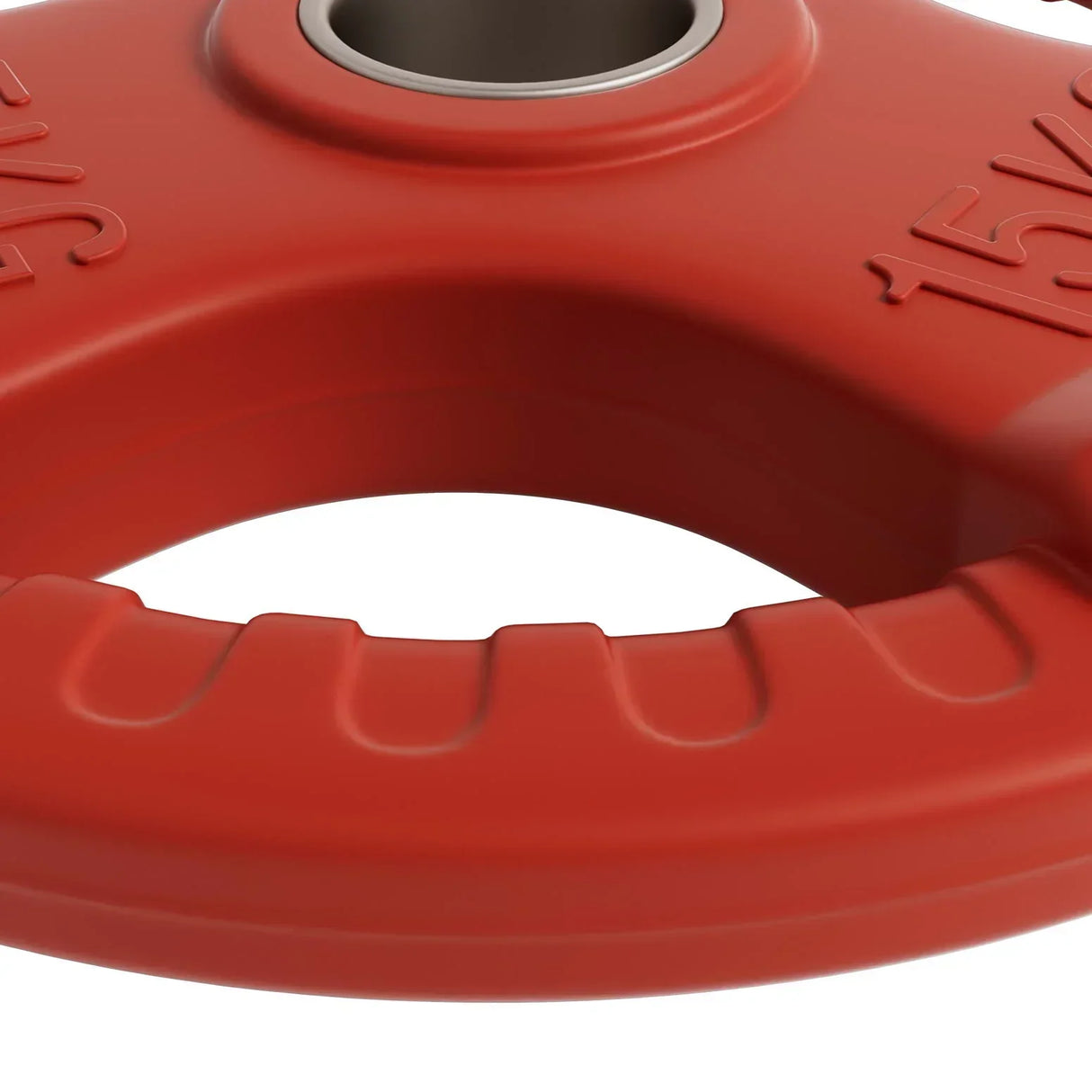 Close-up of a red 15kg weight plate with grip handles and central metal ring