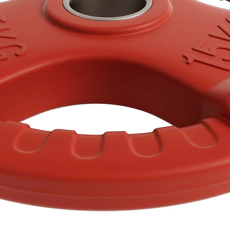 Close-up of a red 15kg weight plate with grip handles and central metal ring