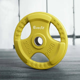 Yellow 20kg Everfit weight plate with hand grips on gym floor