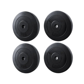 Set of four black barbell weight plates, two 5kg and two 10kg, on white background