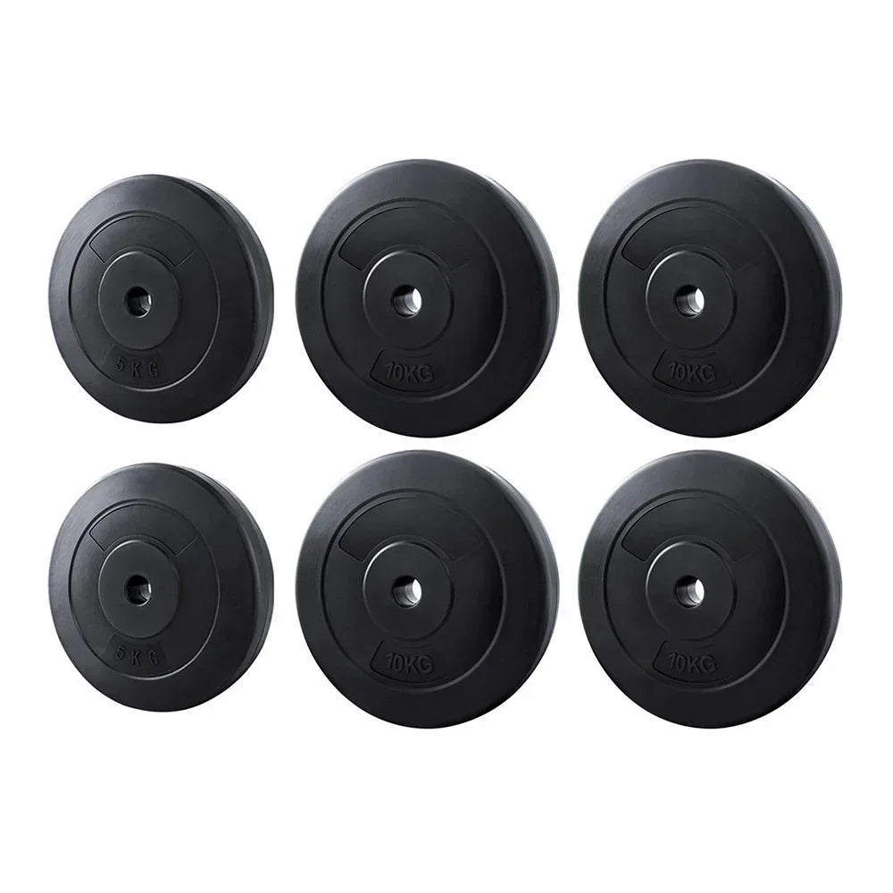 Set of six black weight plates with 5kg and 10kg markings for gym or home fitness