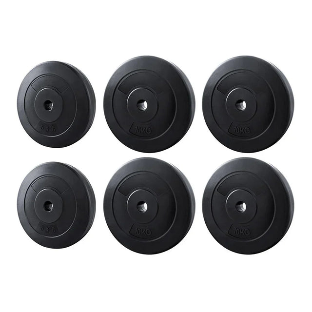 Set of six black weight plates with 5kg and 10kg markings for gym or home fitness