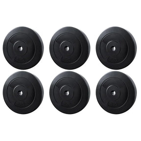 Set of six black 10kg weight plates arranged in two rows, gym equipment on white background