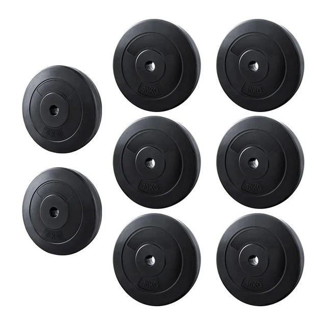 Set of eight black weight plates, 5kg and 10kg, for home gym or barbell training