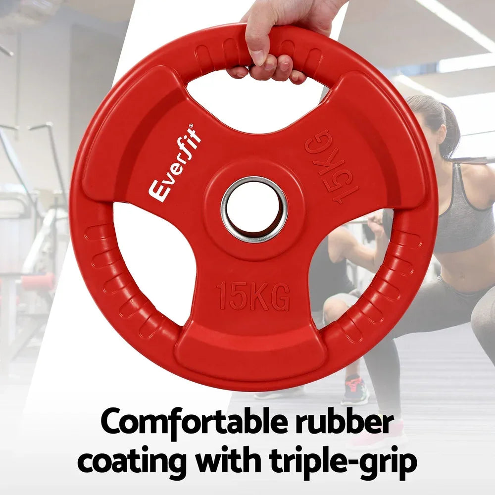 Red 15kg triple-grip rubber weight plate held in gym setting, fitness equipment