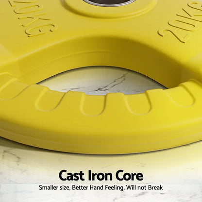 Close-up of yellow 20kg cast iron weight plate with grip handle on marble surface.