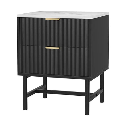 Black bedside table with fluted drawers, gold handles, and white marble top