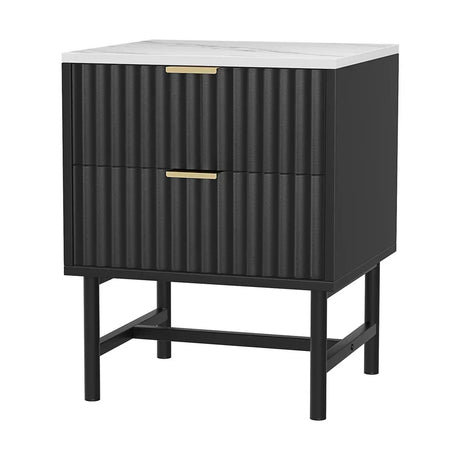 Black bedside table with fluted drawers, gold handles, and white marble top
