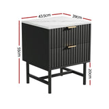 Black bedside table with gold handles, ribbed drawer fronts, marble top, and measurements shown.