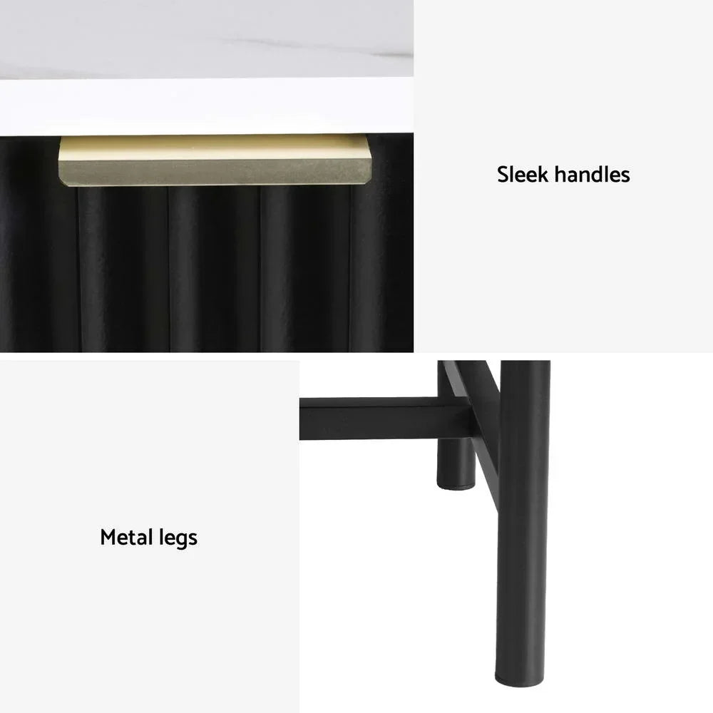 Close-up of black cabinet with gold sleek handle, white top, and sturdy metal legs