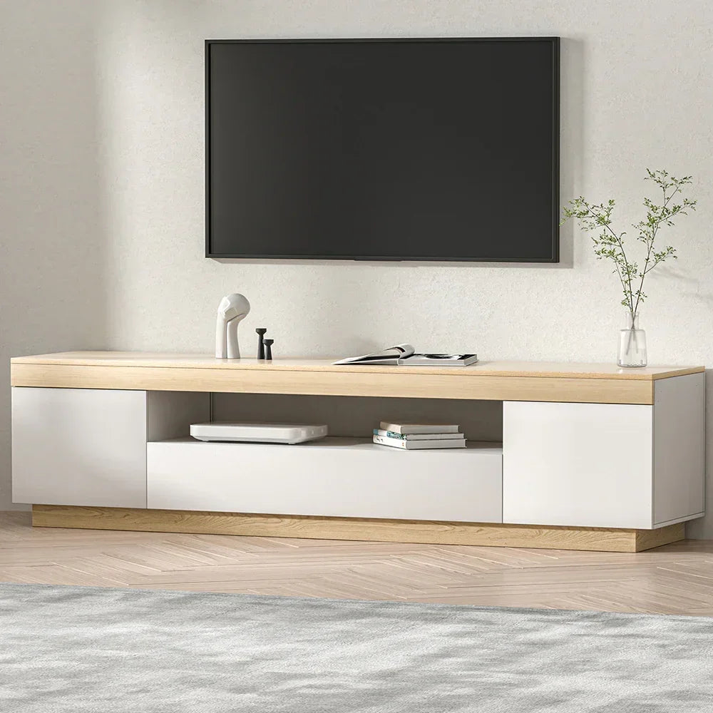 Modern white and wood TV unit with storage shelves in a minimalist living room setting