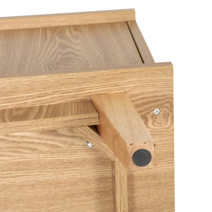 Close-up of wooden furniture corner with visible screws and sturdy light oak finish
