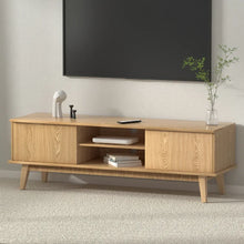 Scandinavian style wooden TV unit with open shelves and decorative items in living room
