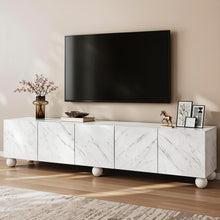 White marble TV stand with modern decor and flat-screen TV