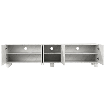 White marble-effect TV unit with open doors, adjustable shelves, and spherical feet for modern living room storage