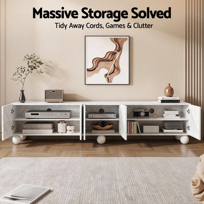 Marble TV stand with open doors, storing electronics, books, and decor for tidy living room storage