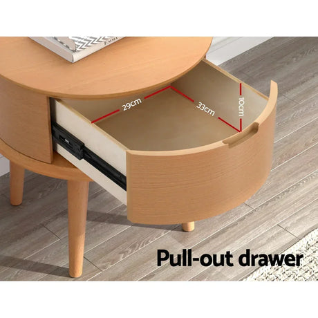Round wooden bedside table with pull-out drawer showing internal dimensions