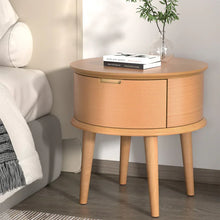 Round wooden bedside table with storage, books and plant decor, modern bedroom furniture