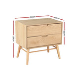 Light wood bedside table with two drawers, angled legs, and dimensions labeled in centimeters.