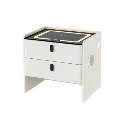 Modern white bedside table with two drawers, LED lighting, and wireless charging panel.