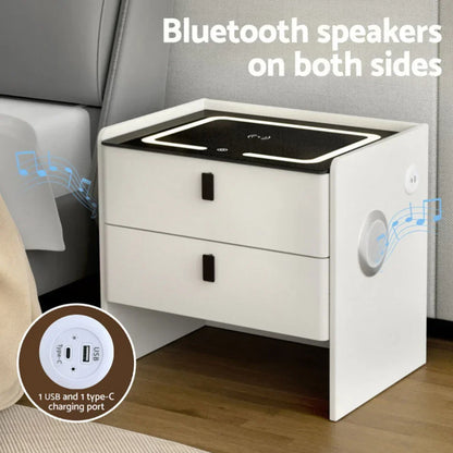 Modern white bedside table with Bluetooth speakers, LED lights, and USB type-C charging ports.
