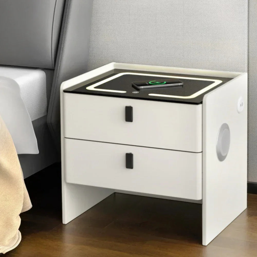 Modern white bedside table with two drawers, LED top, and wireless phone charging