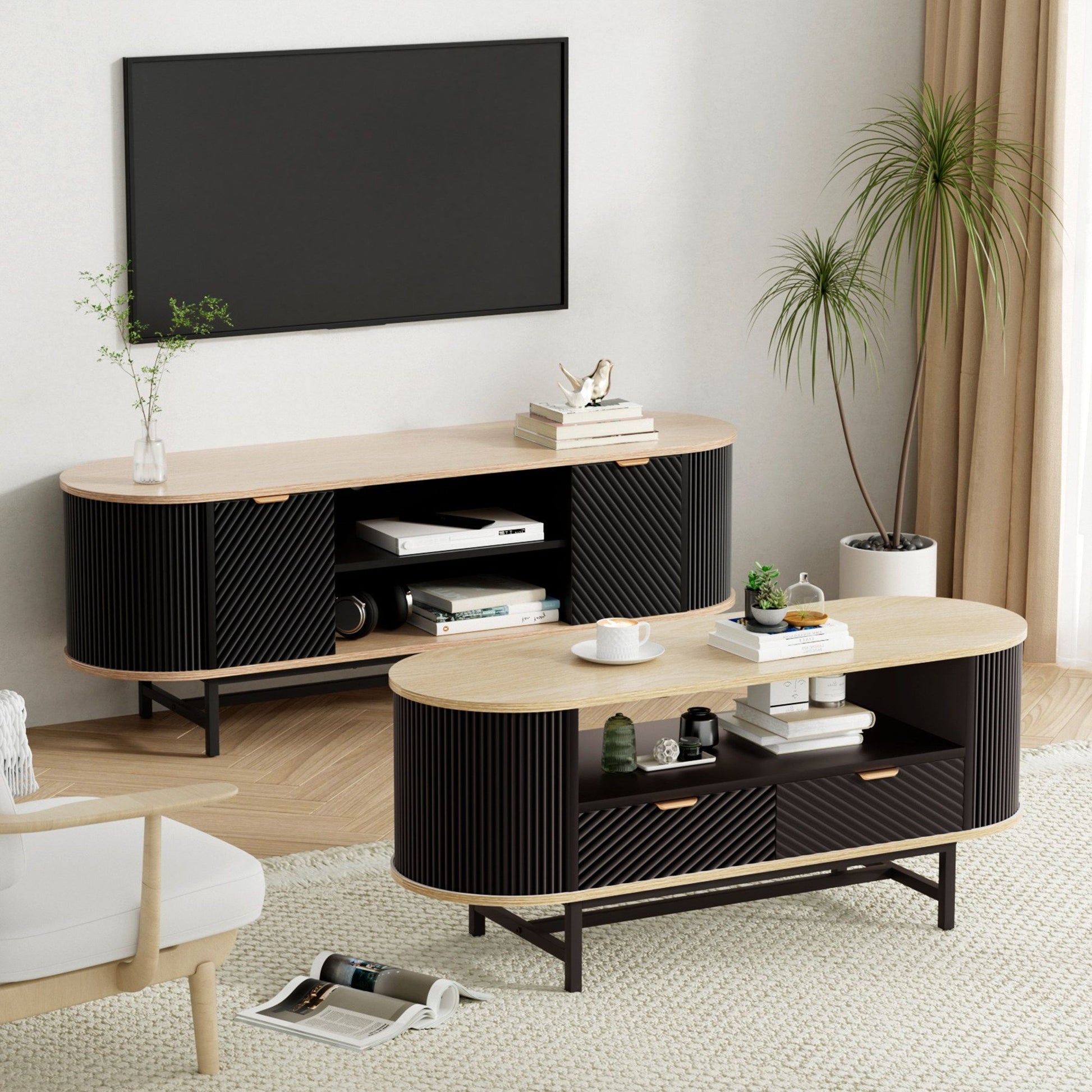 Modern black and wood TV stand & coffee table set with storage, styled in cozy living room with plant and TV