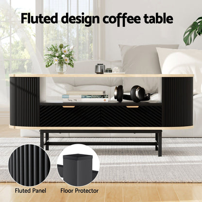 Fluted design coffee table with black panels and gold handles in modern living room