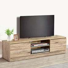 Modern wooden TV unit with flat screen TV, storage shelves, and home decor accents
