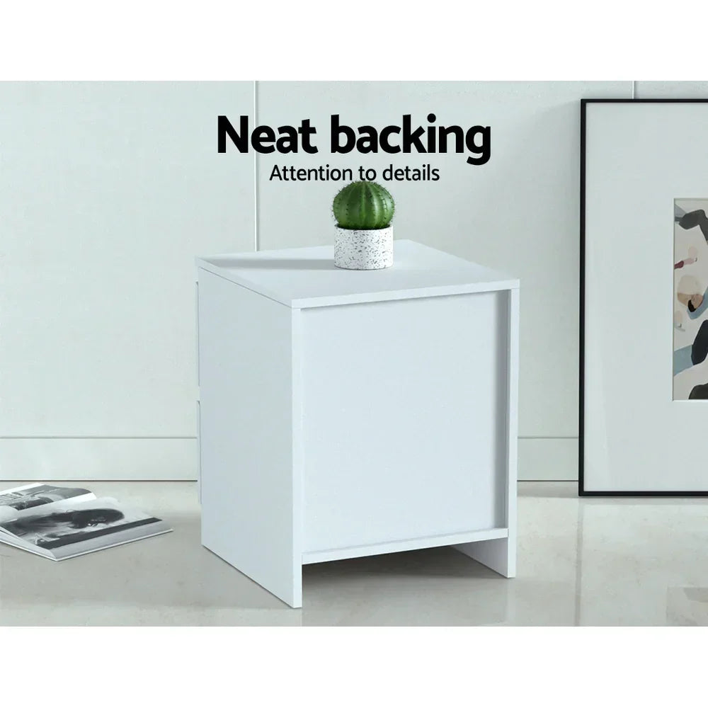 White minimalist bedside table with neat backing, cactus decor, and modern interior setting.