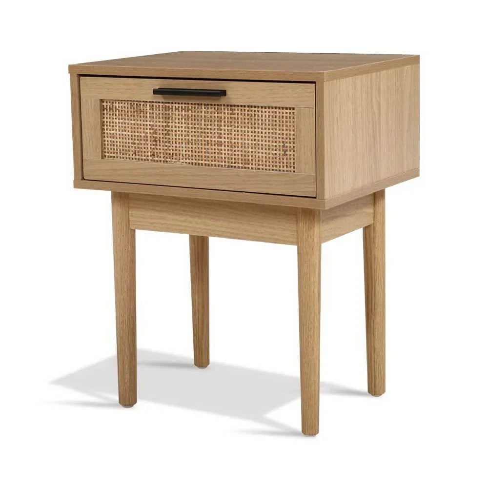 Modern wooden bedside table with cane drawer front and minimalist black handle