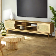 Modern wooden TV stand with rattan accents, open shelves, and decorative vases in a living room