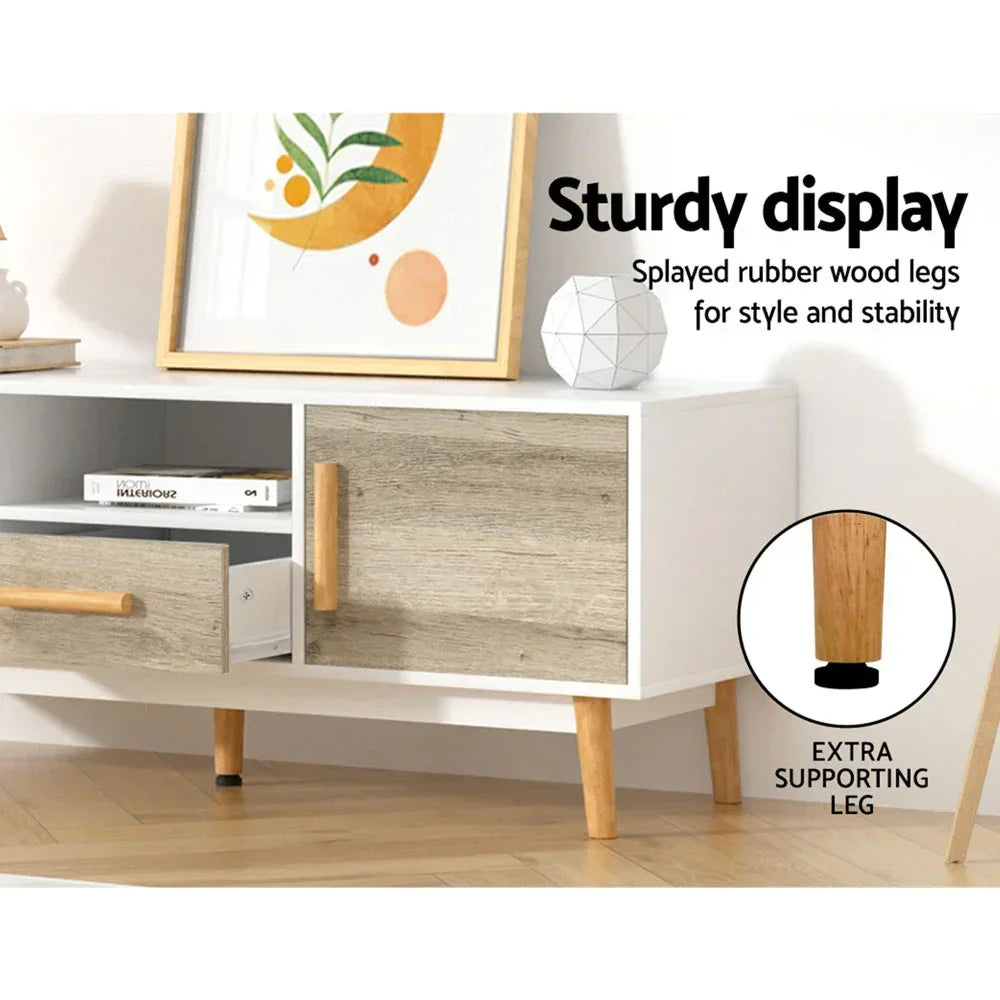 Modern TV unit with splayed wood legs, two storage drawers, and minimalist decor on top.