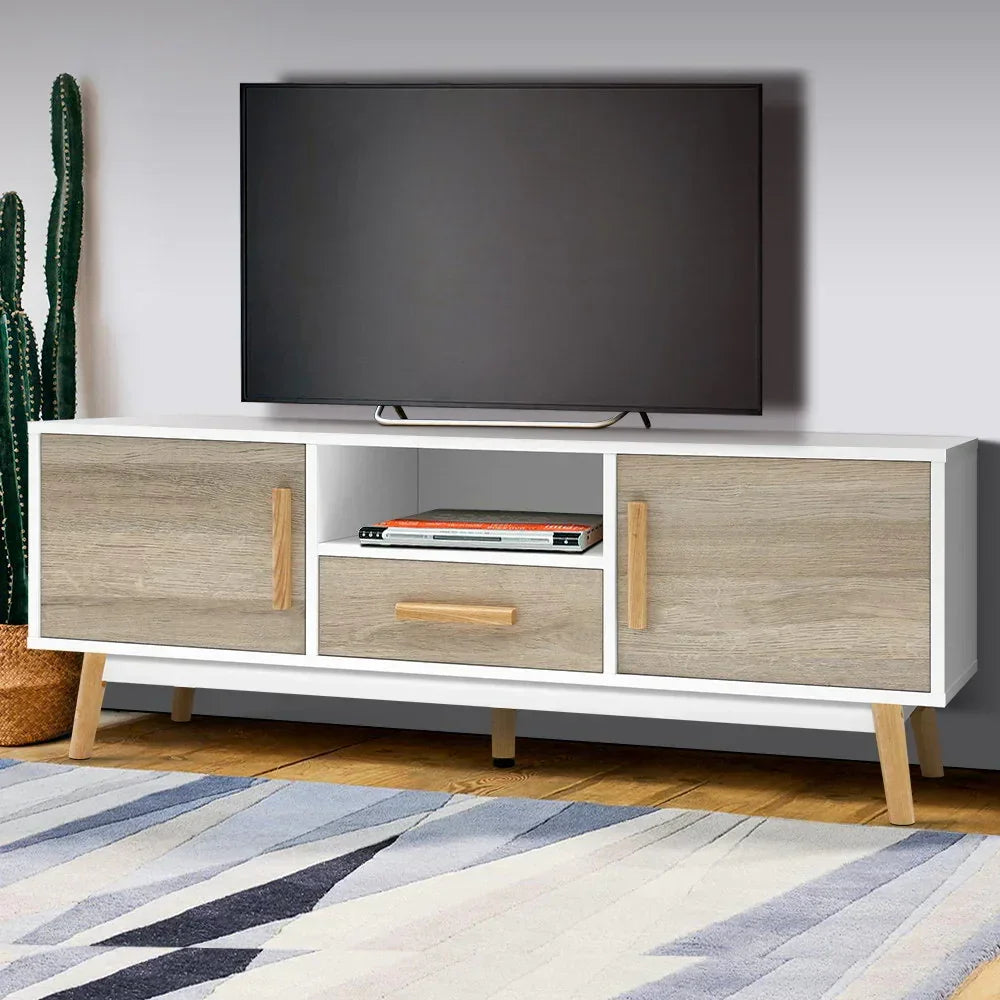 Modern wooden TV stand with storage cabinets and drawer, flat-screen TV on top, indoor setting