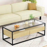 Modern glass and wood coffee table with black metal frame in a living room setting