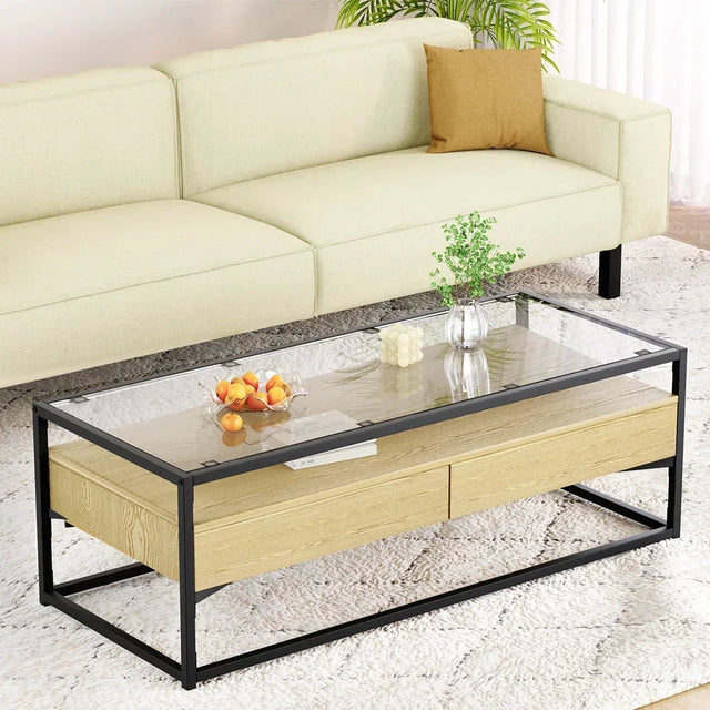 Modern glass and wood coffee table with black metal frame in a living room setting
